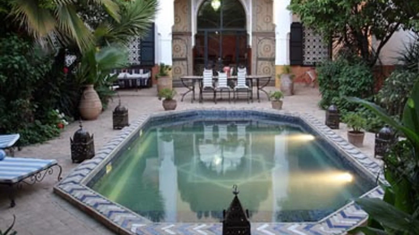 Traditional riad patio in Marrakech illustrating charm and investment risks.